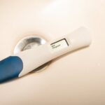 Close-up of a digital pregnancy test showing a negative result on a white surface.